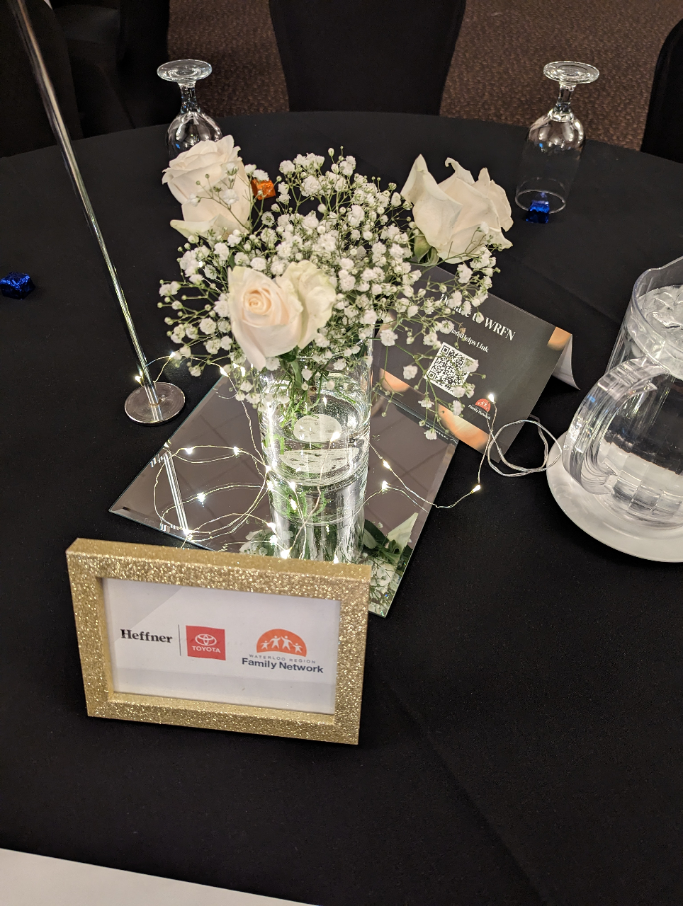 The photo is of the beautiful white floral arrangement placed at each event table for the evening. 